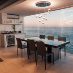 a modern dining area featuring a gorgeous metal lighting fixture and a view of the ocean