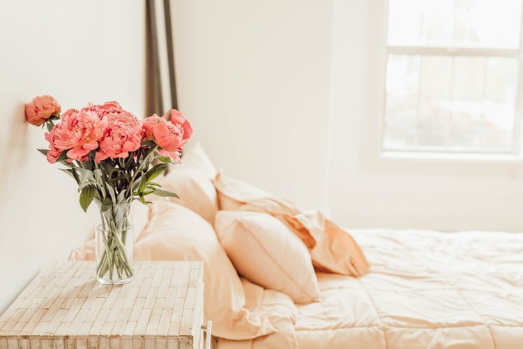 Flower bouquet placed on the bed side table