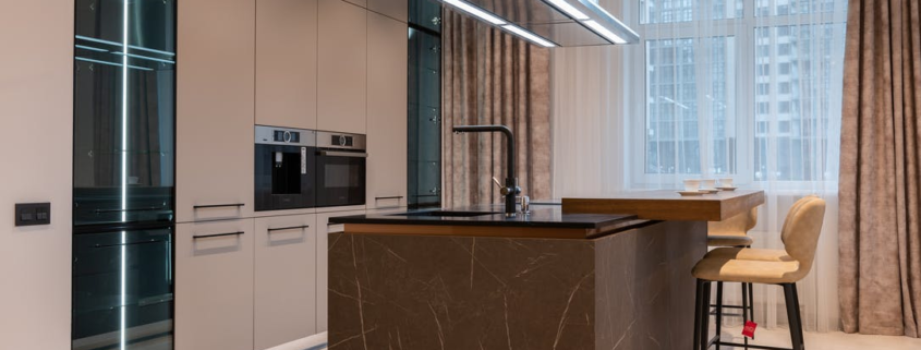 Interior design of a kitchen with floor-to-ceiling cabinets