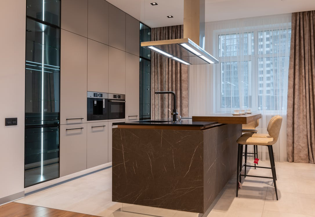 Interior design of a kitchen with floor-to-ceiling cabinets