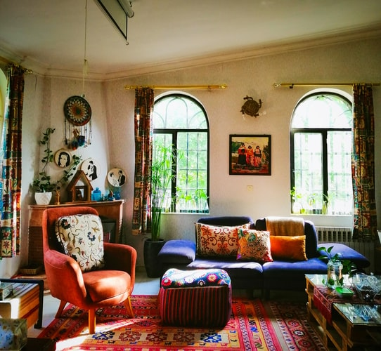 Brightly colored living room furniture paired with many decorations