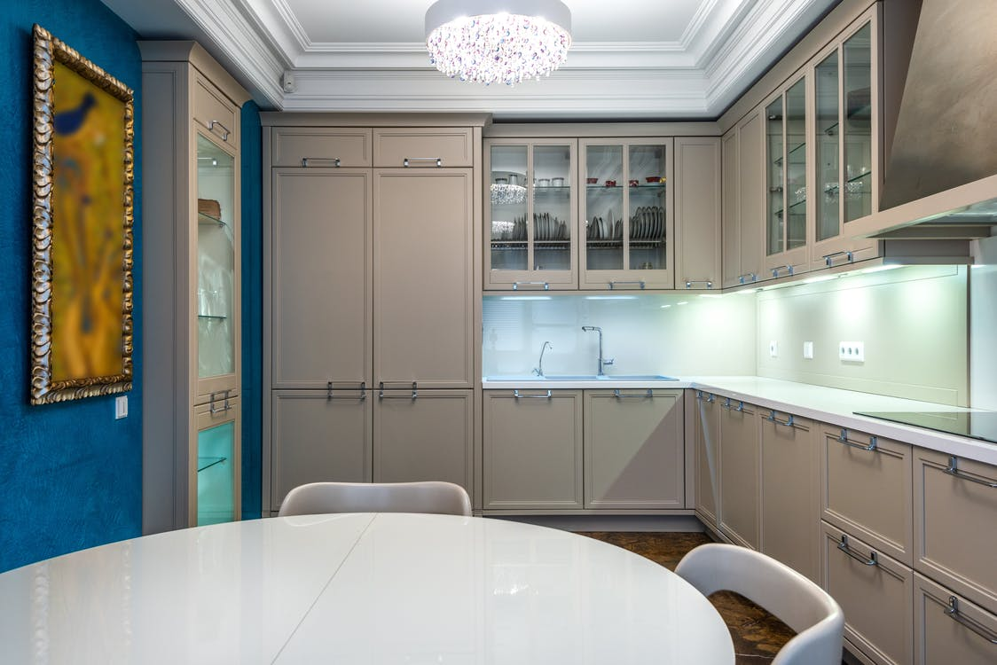 Interior design of a kitchen with glass front cabinets