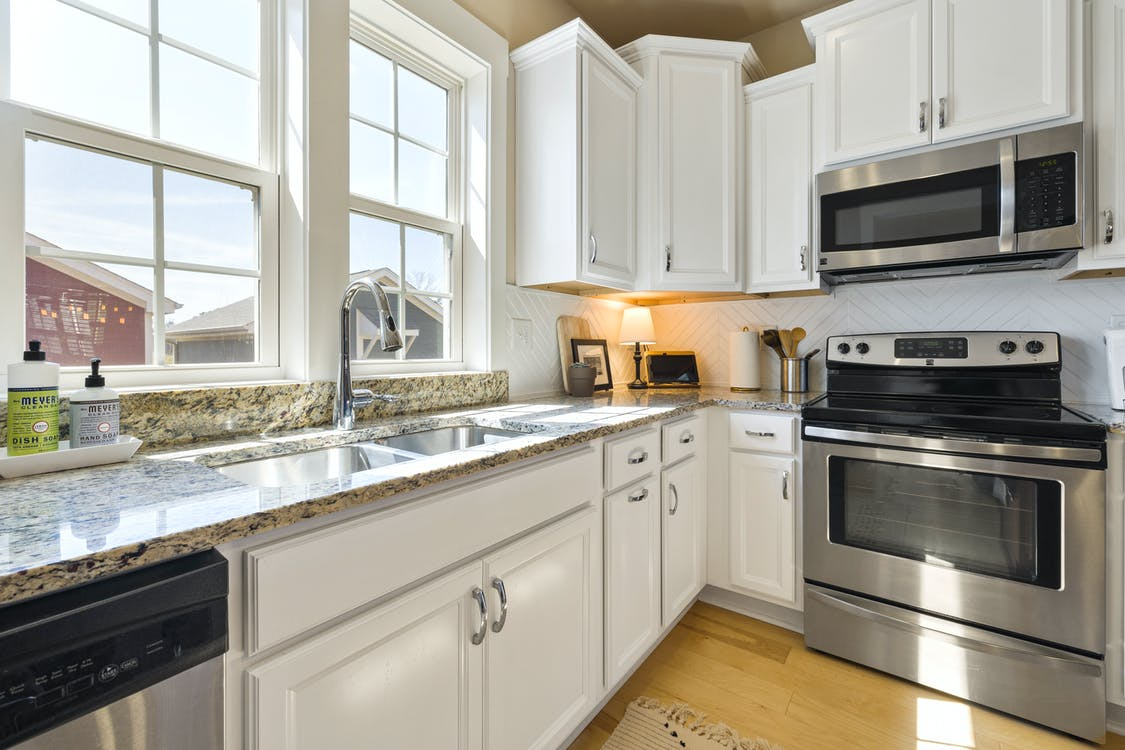 Interior design of a kitchen with inset cabinets