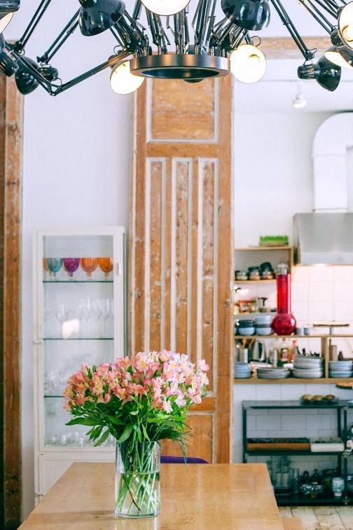 A kitchen with lights descending from ceiling